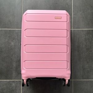 Travelers Choice Pagosa Pink Hardshell Expandable Spinner Wheel Carry-on